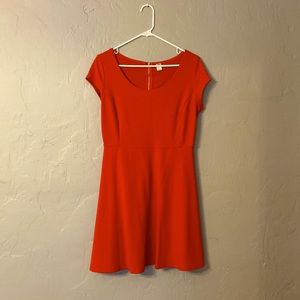 Capped sleeve red dress with gold zipper detail